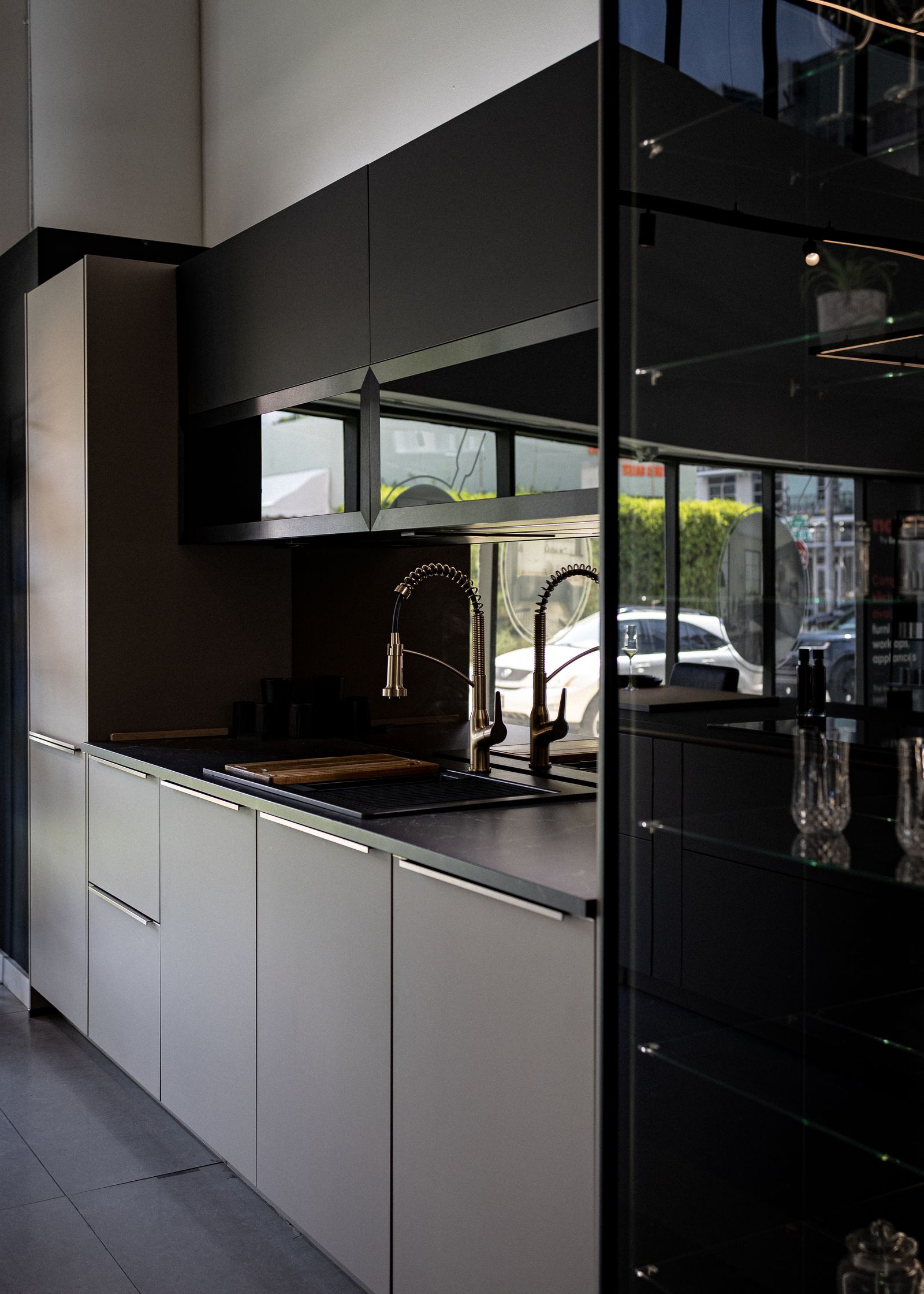 Modern indoor kitchen with white and black cabinetry