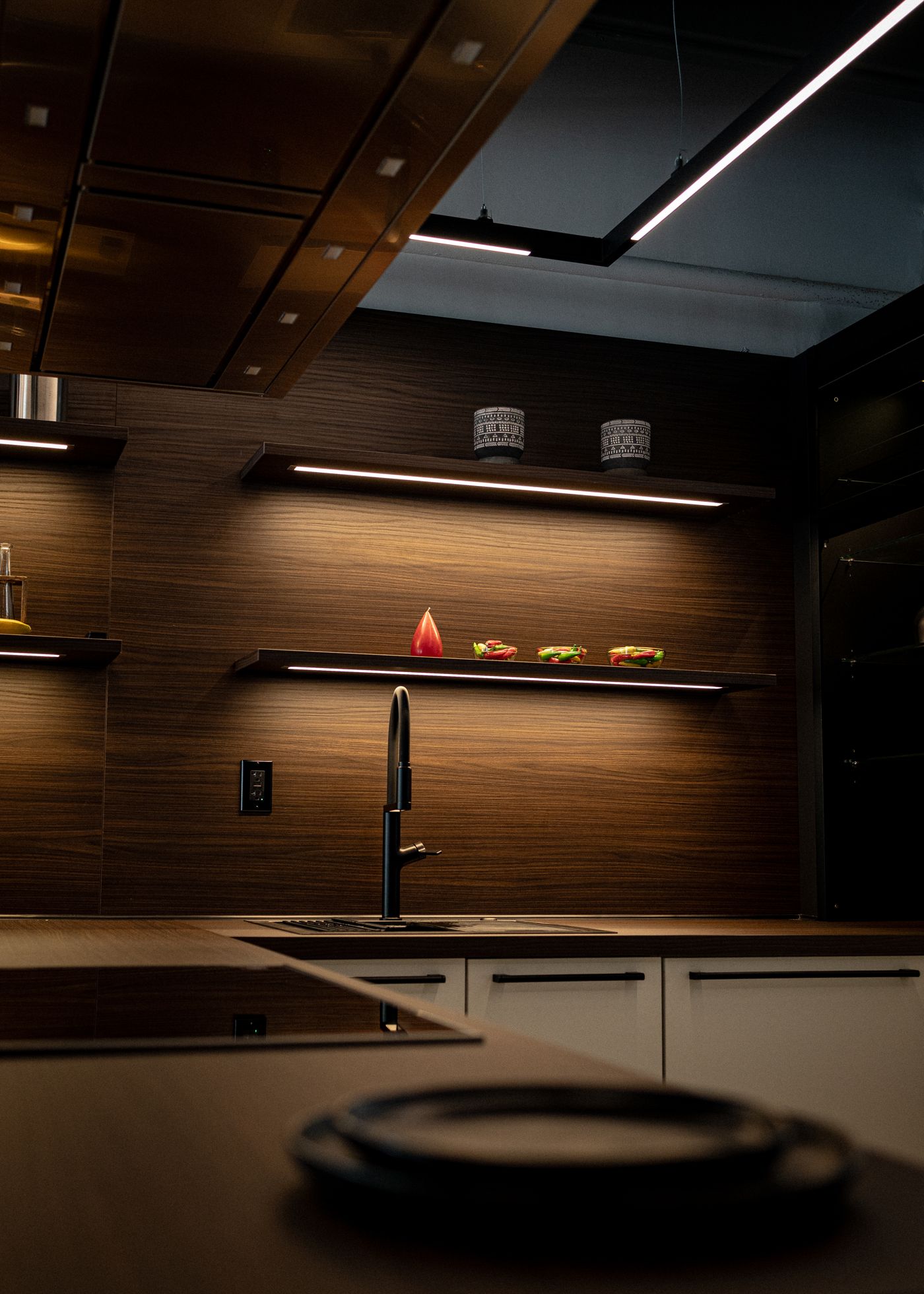nobilia kitchen with dark wood finishes and accent lighting