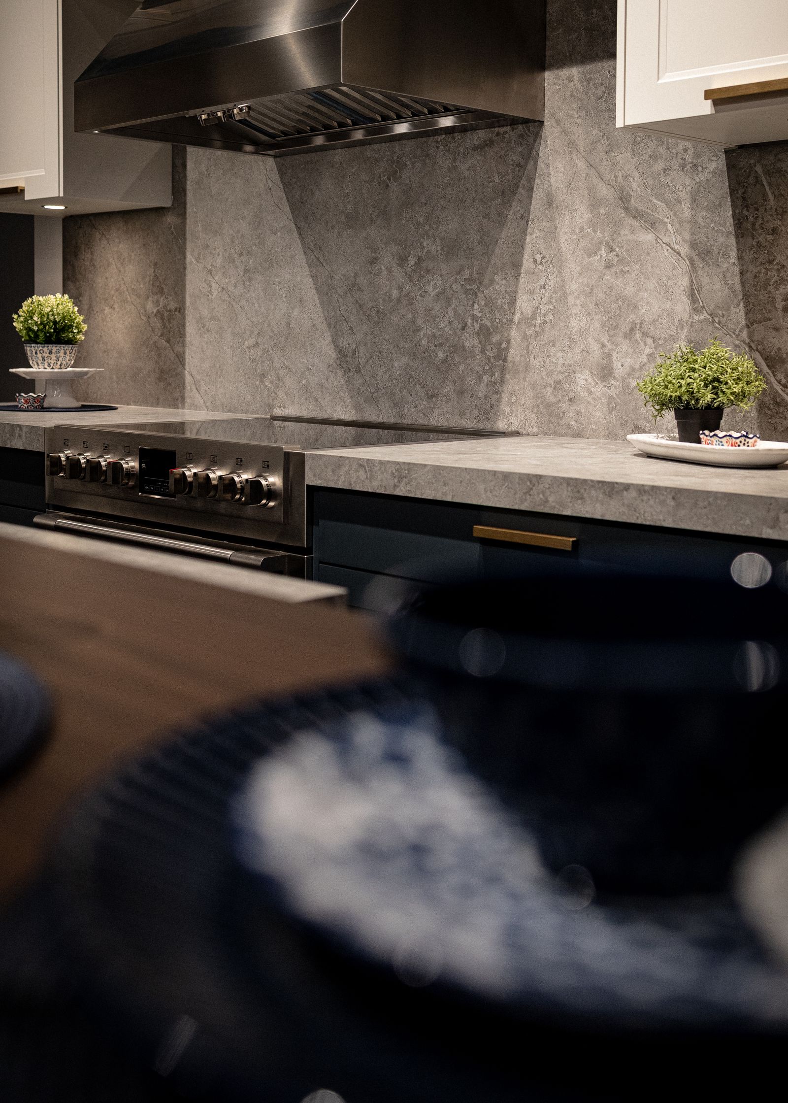 Outdoor kitchen with stone finishes and built-in grill
