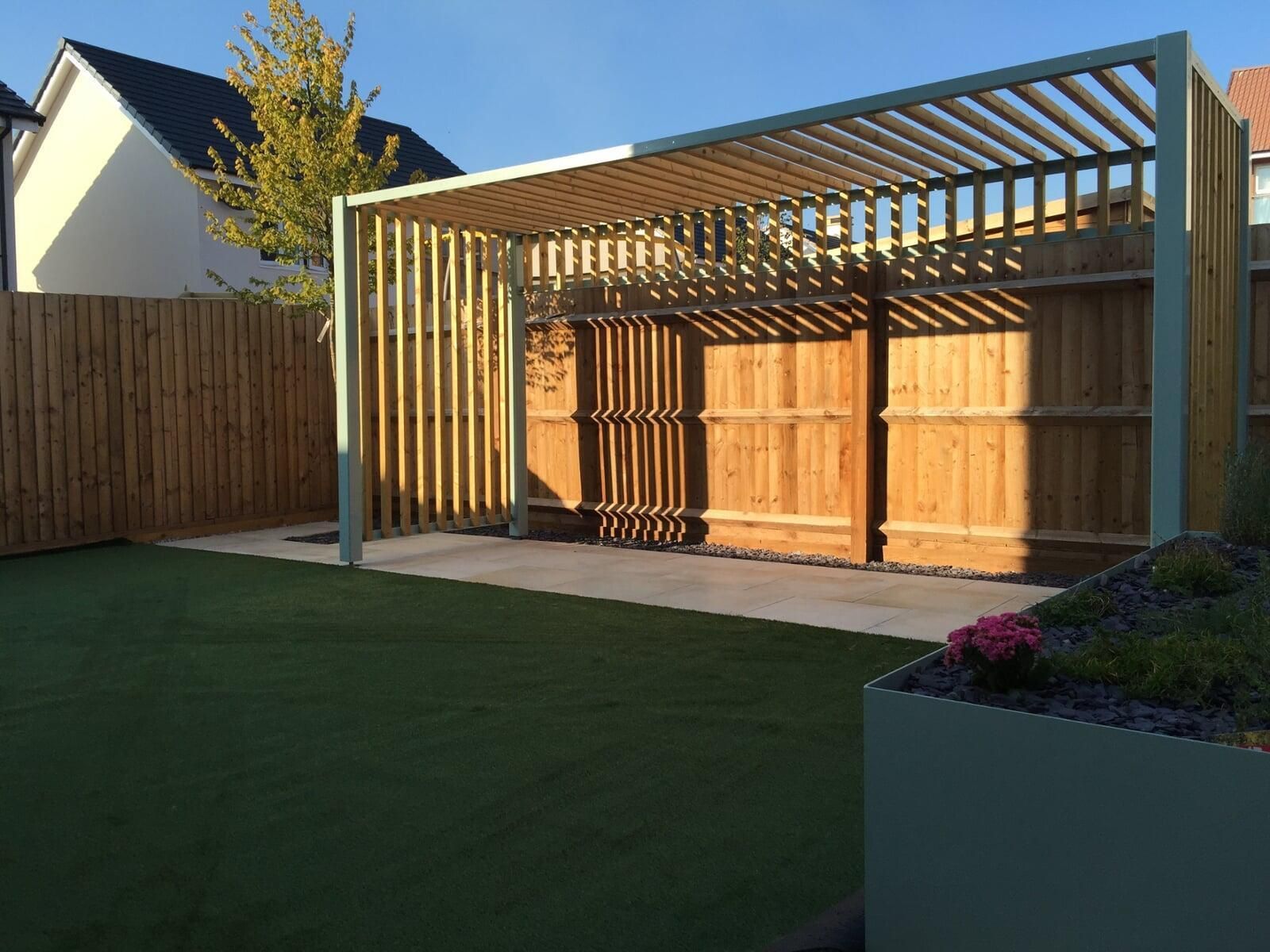 Wooden pergola in a landscaped garden